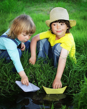 two boy play in stream @Danil Chepko